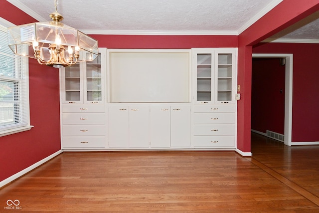 136 W Loretta Dr, Indianapolis, IN 46217 - walk in closet featuring a chandelier and light wood-style flooring