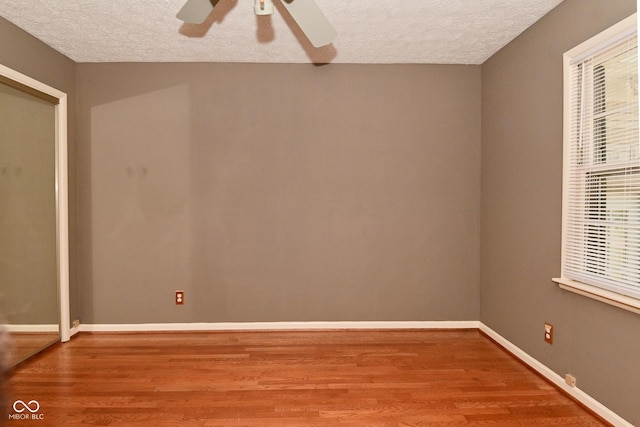 136 W Loretta Dr, Indianapolis, IN 46217 - unfurnished room featuring a textured ceiling, wood finished floors, and a ceiling fan