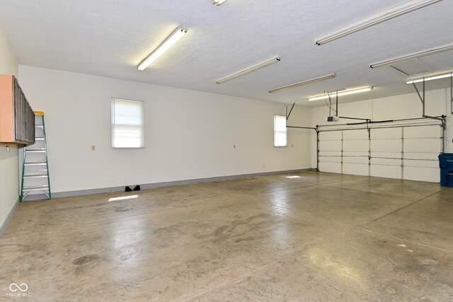 136 W Loretta Dr, Indianapolis, IN 46217 - garage featuring a garage door opener and baseboards