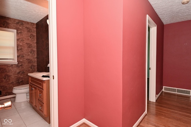 136 W Loretta Dr, Indianapolis, IN 46217 - hall with a textured ceiling and light wood-style flooring