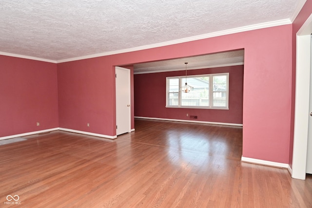 136 W Loretta Dr, Indianapolis, IN 46217 - unfurnished room featuring wood finished floors, a textured ceiling, a chandelier, and crown molding