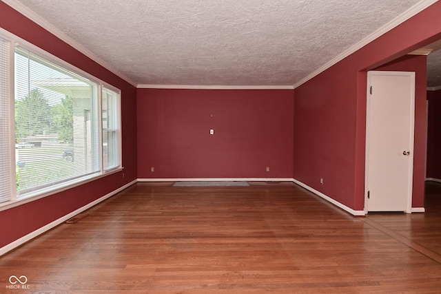 136 W Loretta Dr, Indianapolis, IN 46217 - unfurnished room with wood finished floors, a textured ceiling, and crown molding