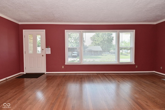 136 W Loretta Dr, Indianapolis, IN 46217 - entrance foyer featuring wood finished floors, a textured ceiling, and crown molding