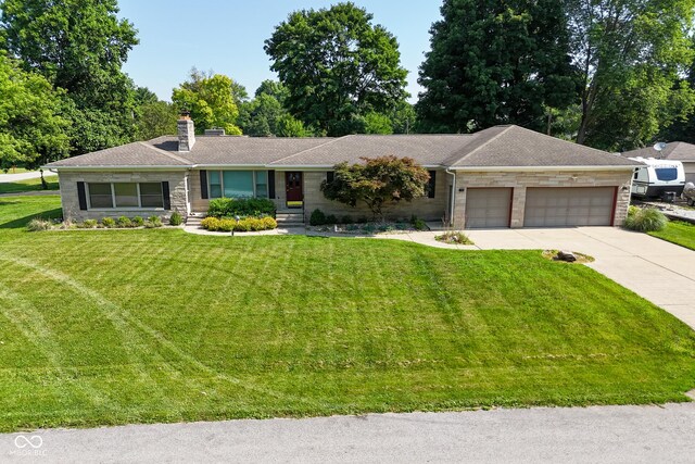 136 W Loretta Dr, Indianapolis, IN 46217 - ranch-style home featuring a garage, driveway, a chimney, a front yard, and stone siding