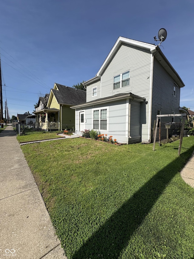 46 S Warman Ave S, Indianapolis, IN 46222 - view of home's exterior featuring a lawn