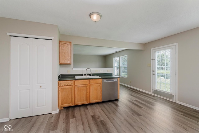 7572 Wymm Ln, Ingalls, IN 46048 - kitchen featuring dishwasher, wood finished floors, dark countertops, and a peninsula