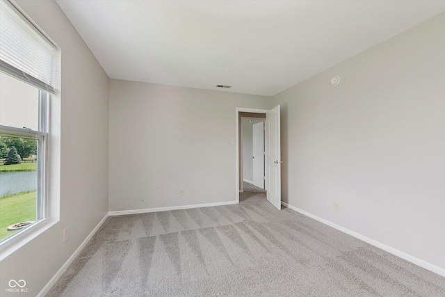 7572 Wymm Ln, Ingalls, IN 46048 - spare room featuring light carpet and a smoke detector
