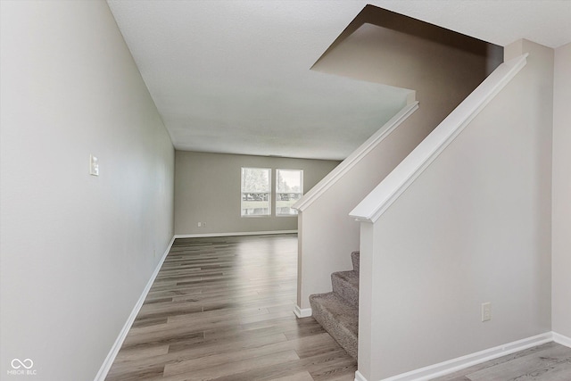7572 Wymm Ln, Ingalls, IN 46048 - stairs with wood finished floors and baseboards