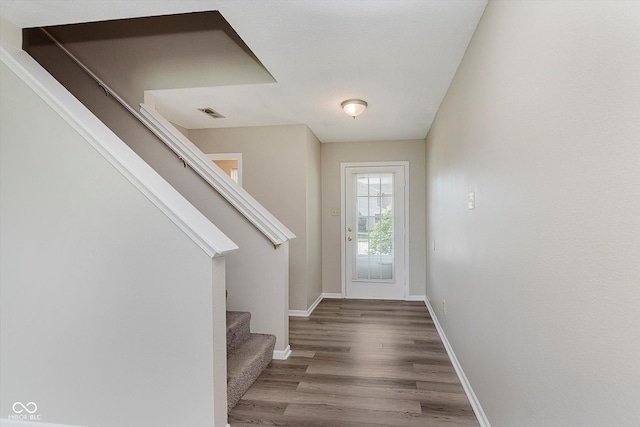 7572 Wymm Ln, Ingalls, IN 46048 - foyer entrance featuring stairs and wood finished floors