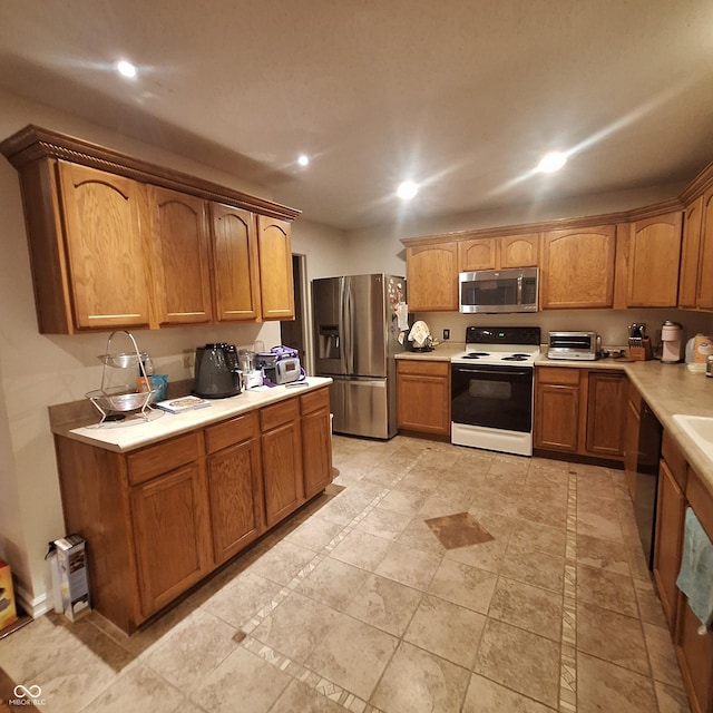 10775 Cyrus Dr, Indianapolis, IN 46231 - kitchen featuring stainless steel appliances, light countertops, recessed lighting, and brown cabinetry