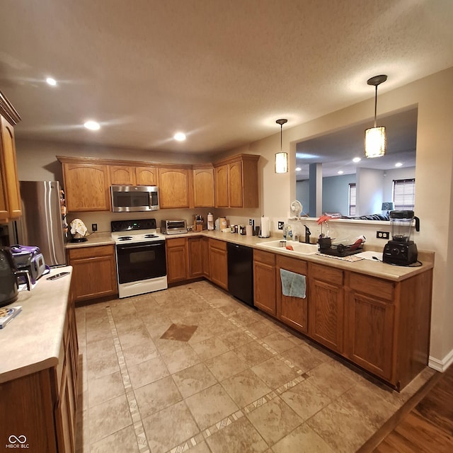 10775 Cyrus Dr, Indianapolis, IN 46231 - kitchen featuring stainless steel appliances, light countertops, hanging light fixtures, brown cabinetry, and recessed lighting