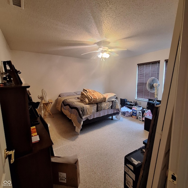 10775 Cyrus Dr, Indianapolis, IN 46231 - carpeted bedroom with a textured ceiling and ceiling fan