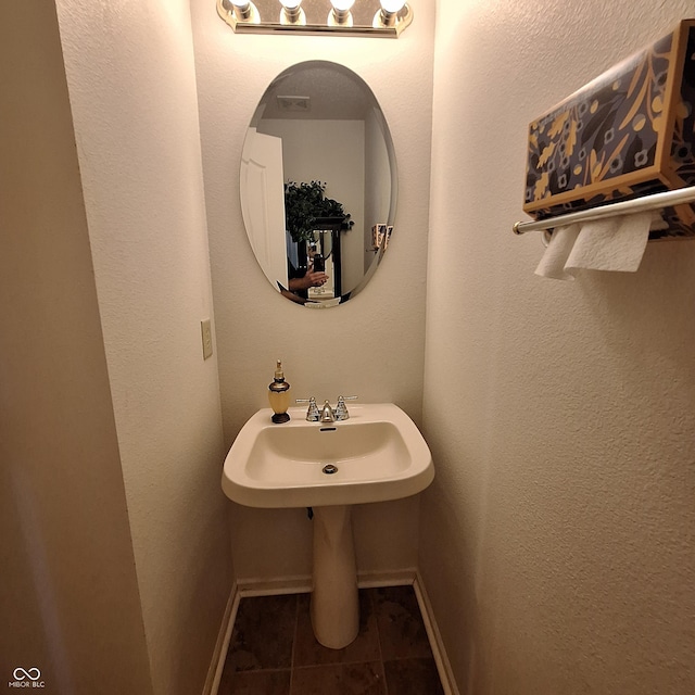 10775 Cyrus Dr, Indianapolis, IN 46231 - bathroom featuring baseboards and tile patterned flooring