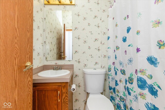 305 Pike St, Darlington, IN 47940 - full bath featuring wallpapered walls, vanity, and a shower with shower curtain