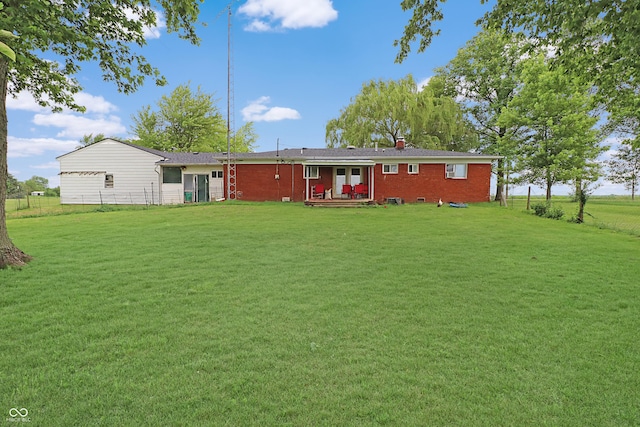 2587 E State Road 55, Wingate, IN 47994 - rear view of property with a lawn, a chimney, brick siding, and a wooden deck