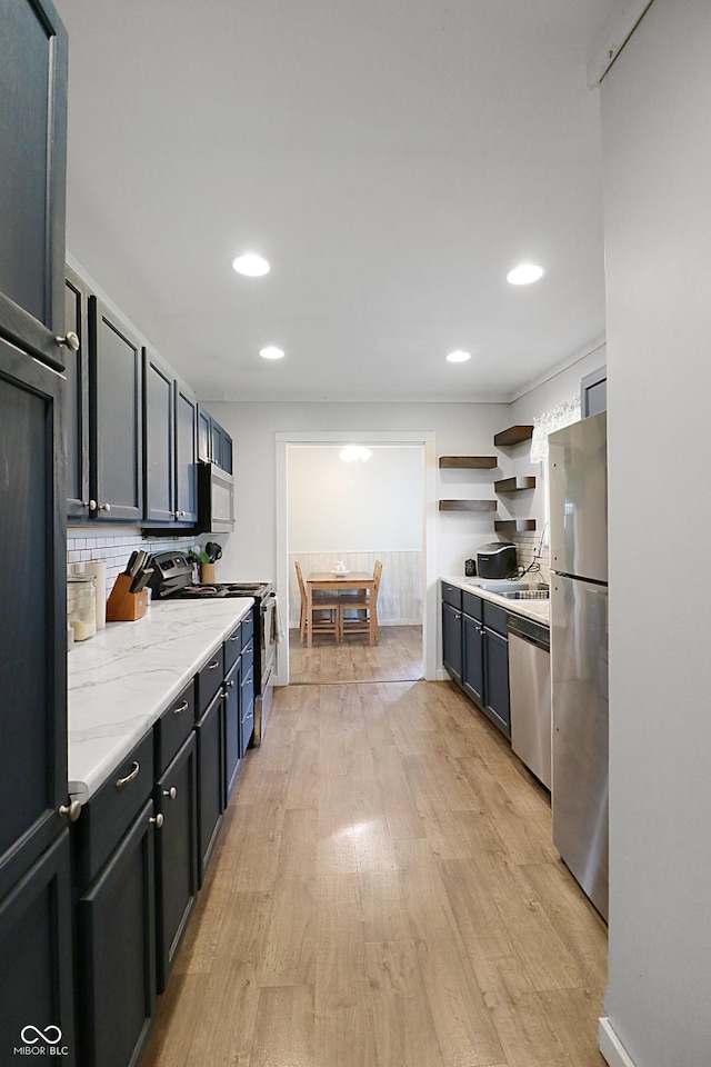 2587 E State Road 55, Wingate, IN 47994 - kitchen featuring stainless steel appliances, light wood finished floors, backsplash, recessed lighting, and light stone countertops