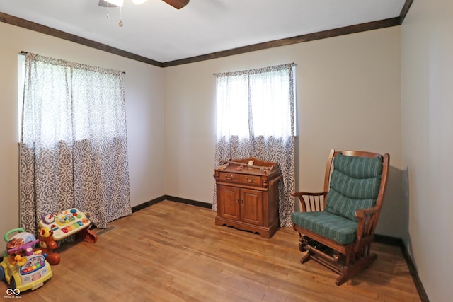 2587 E State Road 55, Wingate, IN 47994 - sitting room featuring light wood finished floors, a ceiling fan, and ornamental molding
