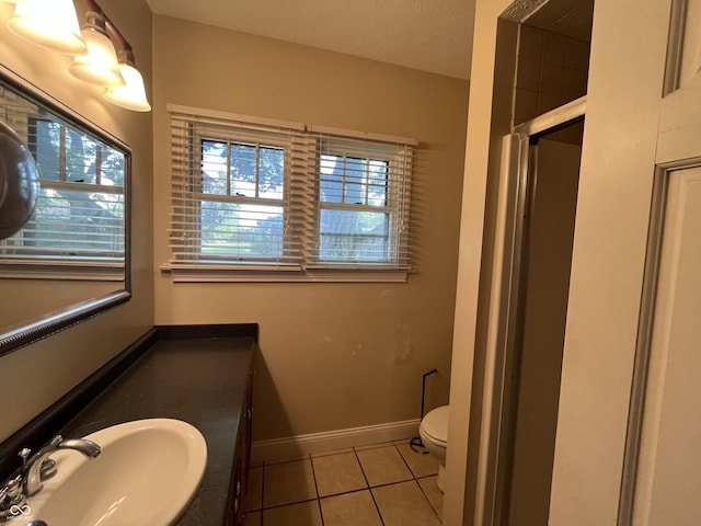 1900 S 25th St, Terre Haute, IN 47802 - bathroom featuring tile patterned flooring, a shower stall, healthy amount of natural light, and vanity
