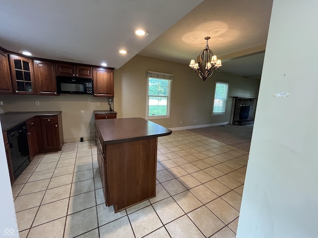 1900 S 25th St, Terre Haute, IN 47802 - kitchen featuring black appliances, light tile patterned floors, dark countertops, a chandelier, and glass insert cabinets