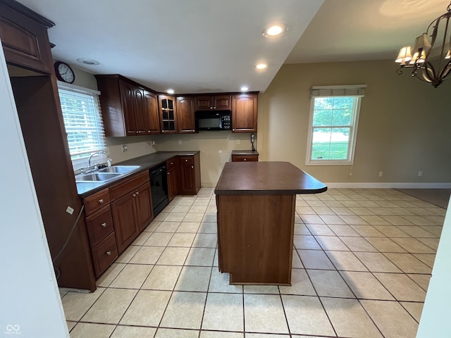 1900 S 25th St, Terre Haute, IN 47802 - kitchen featuring black appliances, dark countertops, light tile patterned floors, and recessed lighting