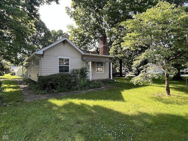 1900 S 25th St, Terre Haute, IN 47802 - view of front of property with a chimney and a front yard