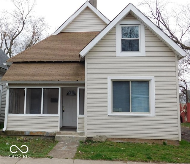 1553 W New York St, Indianapolis, IN 46222 - bungalow-style home with a shingled roof