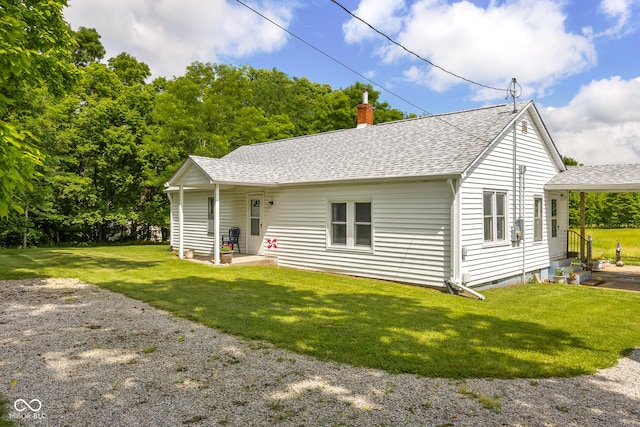 9030 E 700 S, Elizabethtown, IN 47232 - view of front facade featuring a shingled roof, a chimney, and a front yard