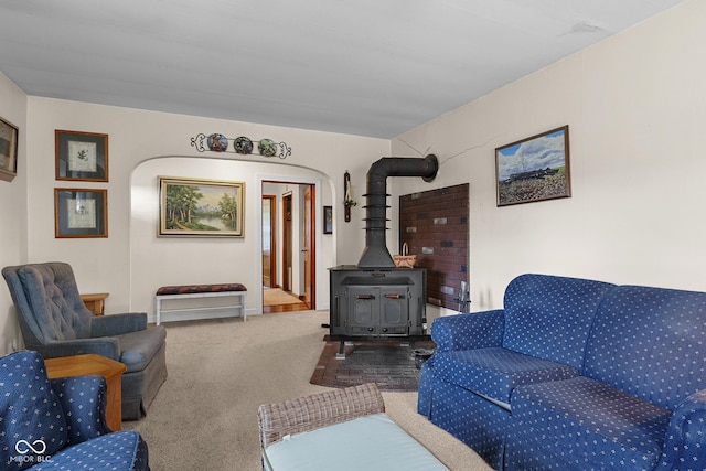 9030 E 700 S, Elizabethtown, IN 47232 - carpeted living area with a wood stove and arched walkways