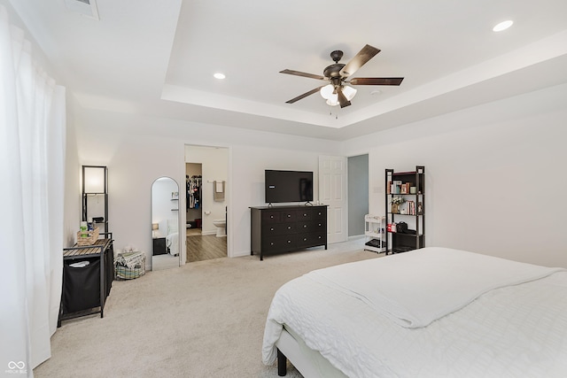 5809 Terracotta Trce, Mccordsville, IN 46055 - bedroom featuring light carpet, a raised ceiling, recessed lighting, ensuite bathroom, and a ceiling fan