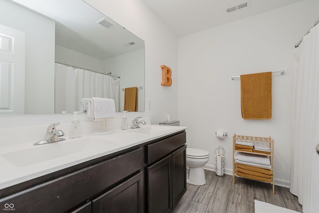 5809 Terracotta Trce, Mccordsville, IN 46055 - full bathroom with double vanity and wood finished floors