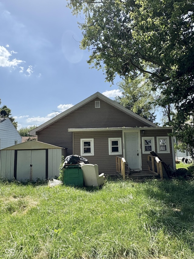 948 S 23rd St, New Castle, IN 47362 - rear view of property featuring a storage shed