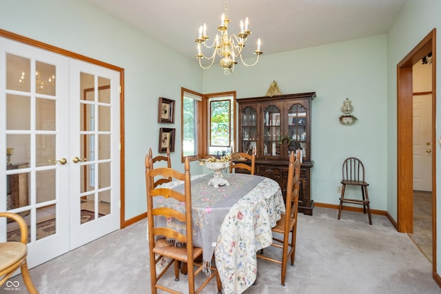 439 Alisa Ave, Seymour, IN 47274 - dining area with french doors, carpet floors, and a chandelier
