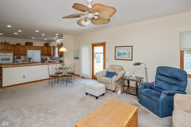 439 Alisa Ave, Seymour, IN 47274 - living room featuring light carpet, healthy amount of natural light, recessed lighting, and a ceiling fan