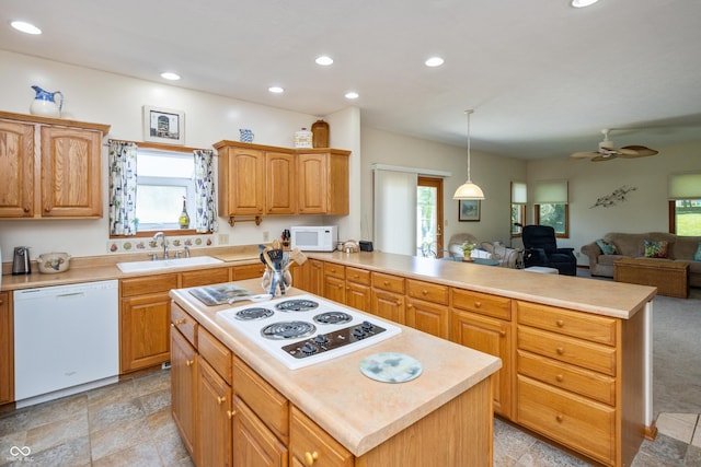 439 Alisa Ave, Seymour, IN 47274 - kitchen featuring white appliances, a peninsula, light countertops, open floor plan, and recessed lighting