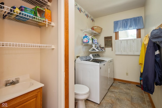 439 Alisa Ave, Seymour, IN 47274 - laundry room with washing machine and clothes dryer and stone finish floors