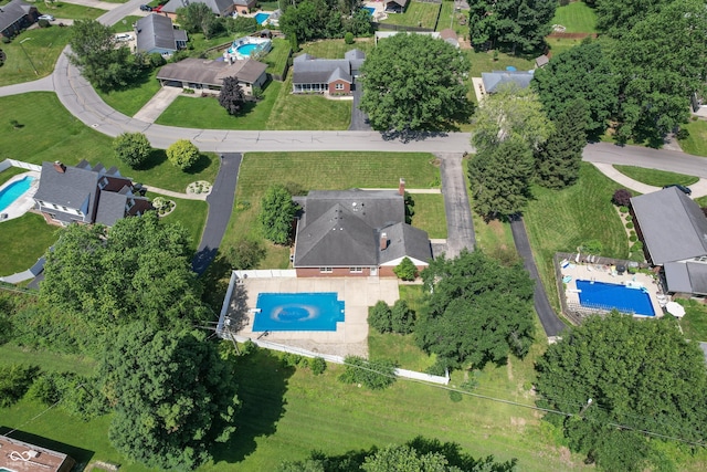 660 E Dr, Seymour, IN 47274 - aerial overview of property's location with a pool and nearby suburban area