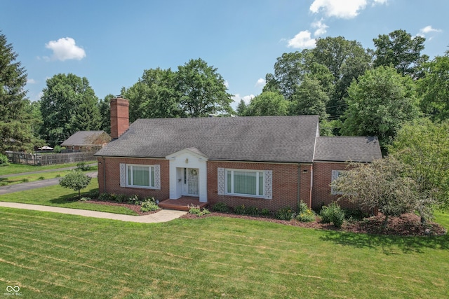 660 E Dr, Seymour, IN 47274 - view of front of house with brick siding, a chimney, and a shingled roof