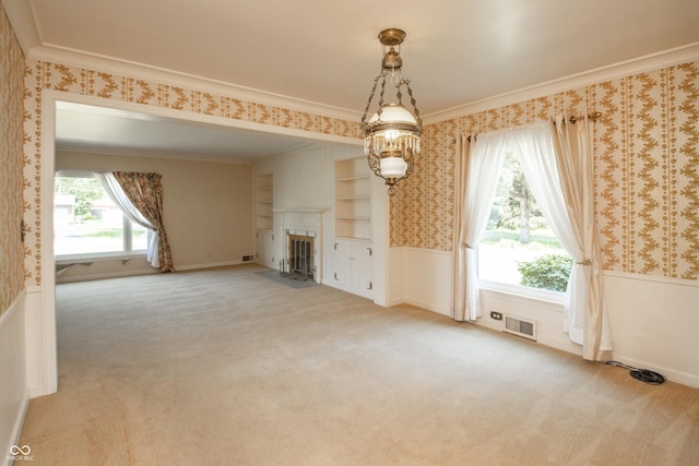 660 E Dr, Seymour, IN 47274 - unfurnished living room featuring wallpapered walls, a wainscoted wall, light carpet, healthy amount of natural light, and ornamental molding