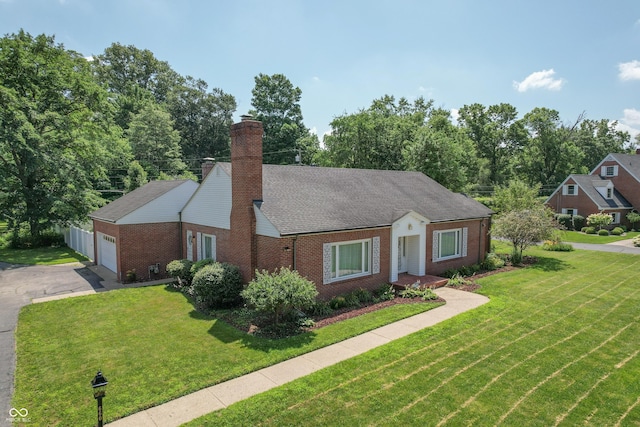 660 E Dr, Seymour, IN 47274 - view of front of house with brick siding, a front lawn, a garage, and driveway