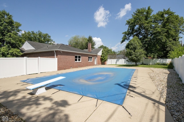 660 E Dr, Seymour, IN 47274 - view of pool with a diving board, a fenced backyard, and a patio