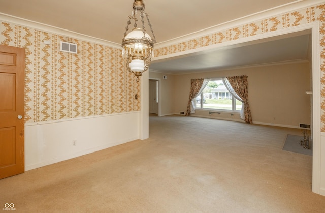 660 E Dr, Seymour, IN 47274 - carpeted empty room featuring wainscoting, crown molding, wallpapered walls, and a chandelier