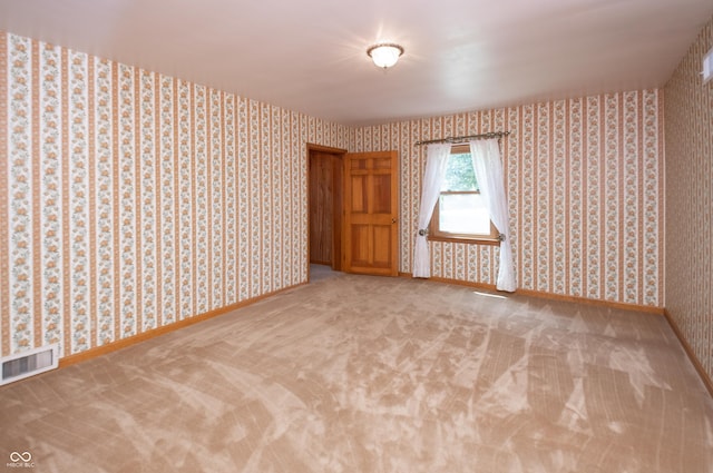 660 E Dr, Seymour, IN 47274 - unfurnished room featuring wallpapered walls and carpet