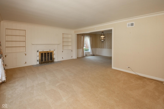 660 E Dr, Seymour, IN 47274 - unfurnished living room with a fireplace with flush hearth, carpet floors, crown molding, and built in shelves