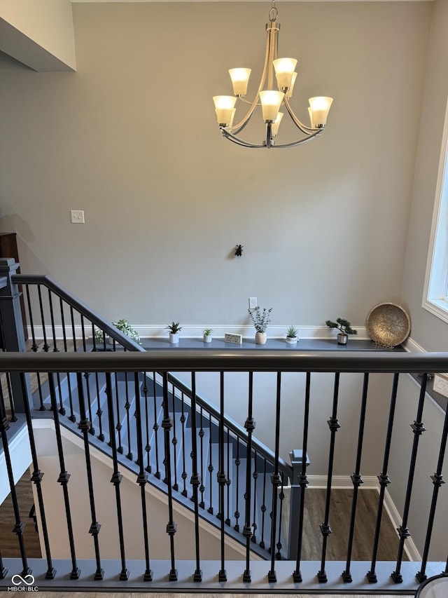 188 Gettysburg, Coatesville, IN 46121 - stairway featuring a chandelier and wood finished floors