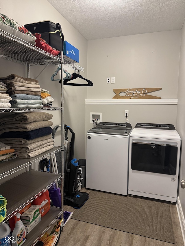 188 Gettysburg, Coatesville, IN 46121 - laundry room featuring washer and clothes dryer and wood finished floors