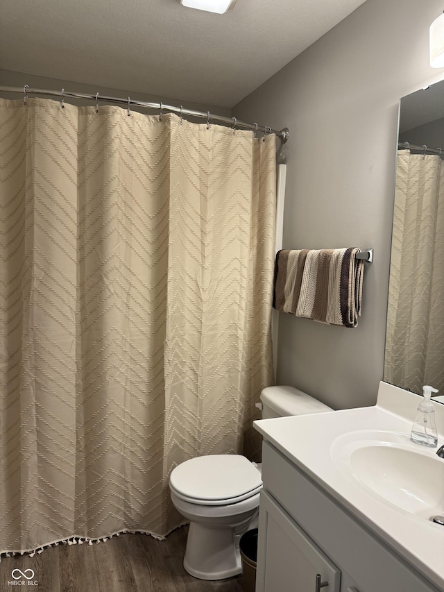 188 Gettysburg, Coatesville, IN 46121 - bathroom with wood finished floors, vanity, and a shower with curtain