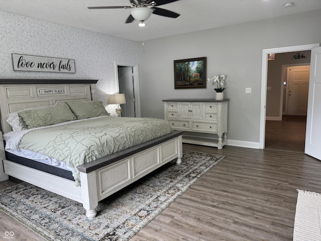 188 Gettysburg, Coatesville, IN 46121 - bedroom featuring wood finished floors, ceiling fan, and wallpapered walls
