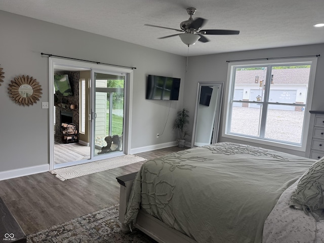 188 Gettysburg, Coatesville, IN 46121 - bedroom with access to exterior, wood finished floors, a textured ceiling, and a ceiling fan