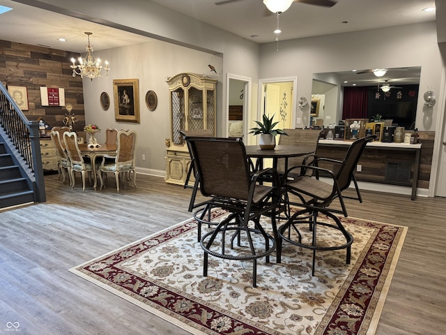 188 Gettysburg, Coatesville, IN 46121 - dining area with a ceiling fan, wood finished floors, a chandelier, recessed lighting, and wood walls