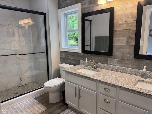 188 Gettysburg, Coatesville, IN 46121 - full bath featuring double vanity, a marble finish shower, and wood finished floors